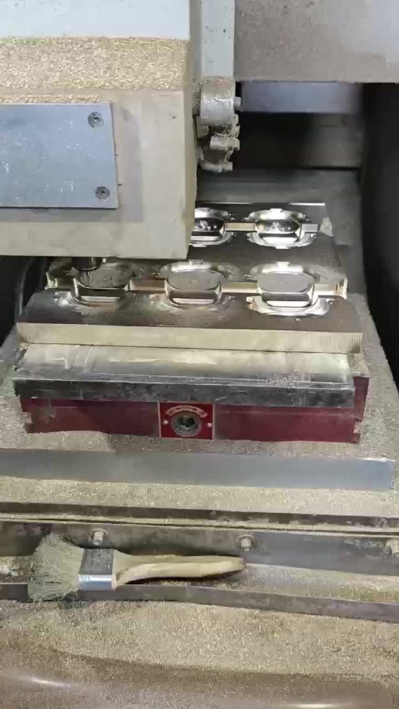 Metal production mold being machined for a custom silicone product in the workshop