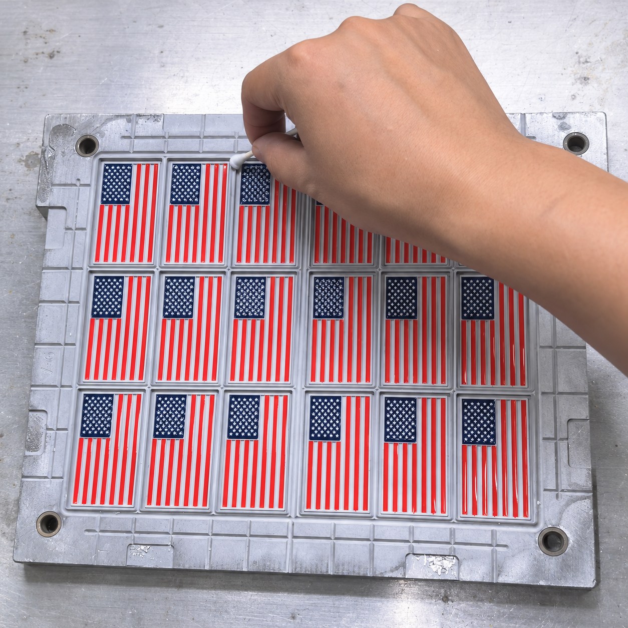Cotton-swab cleaning before loading the white silicone compound.